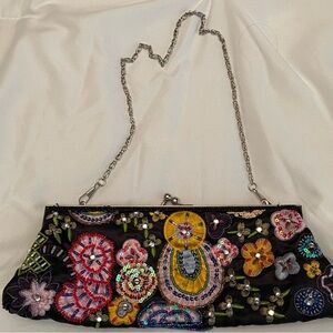 New York’s & Company embroidered and beaded clutch purse.